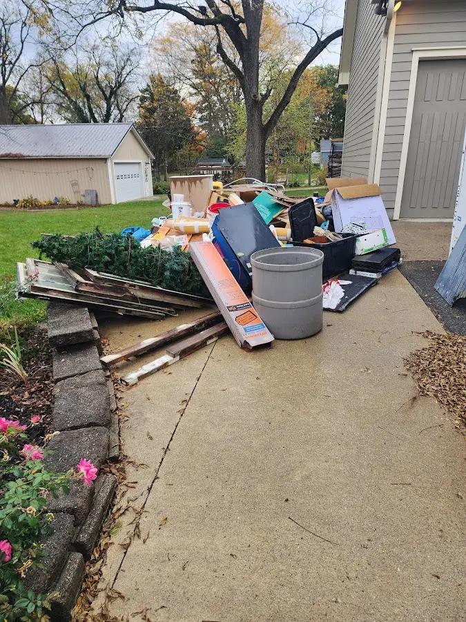 Dumpster being loaded with debris for 10 Yard Dumpster Rental in Kennett Square
